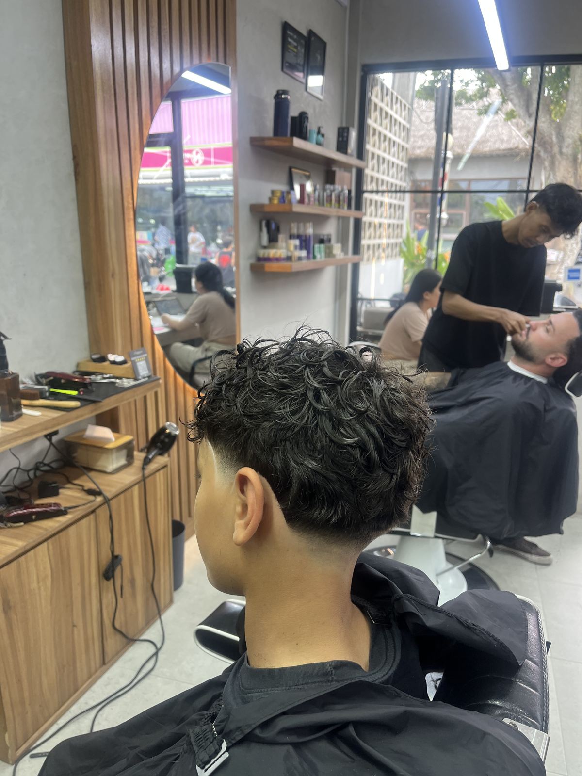 Curly top with a taper, seen from behind